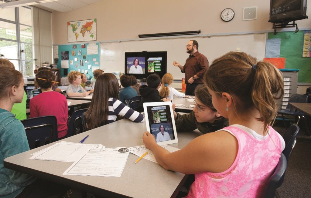Elementary students distance learning in classroom