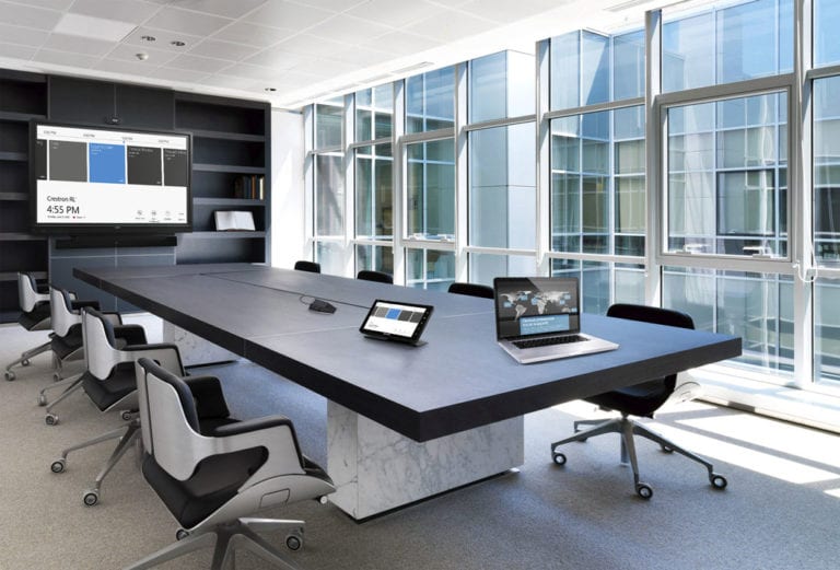 Boardroom with windows and Crestron controls.